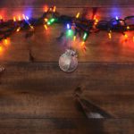 33935183 – three silver ornaments and christmas lights